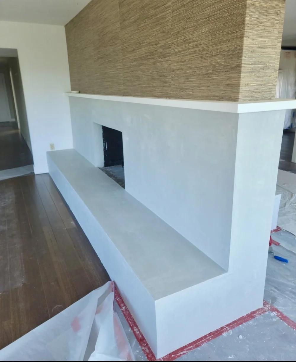 Custom plaster fireplace in a finished living room